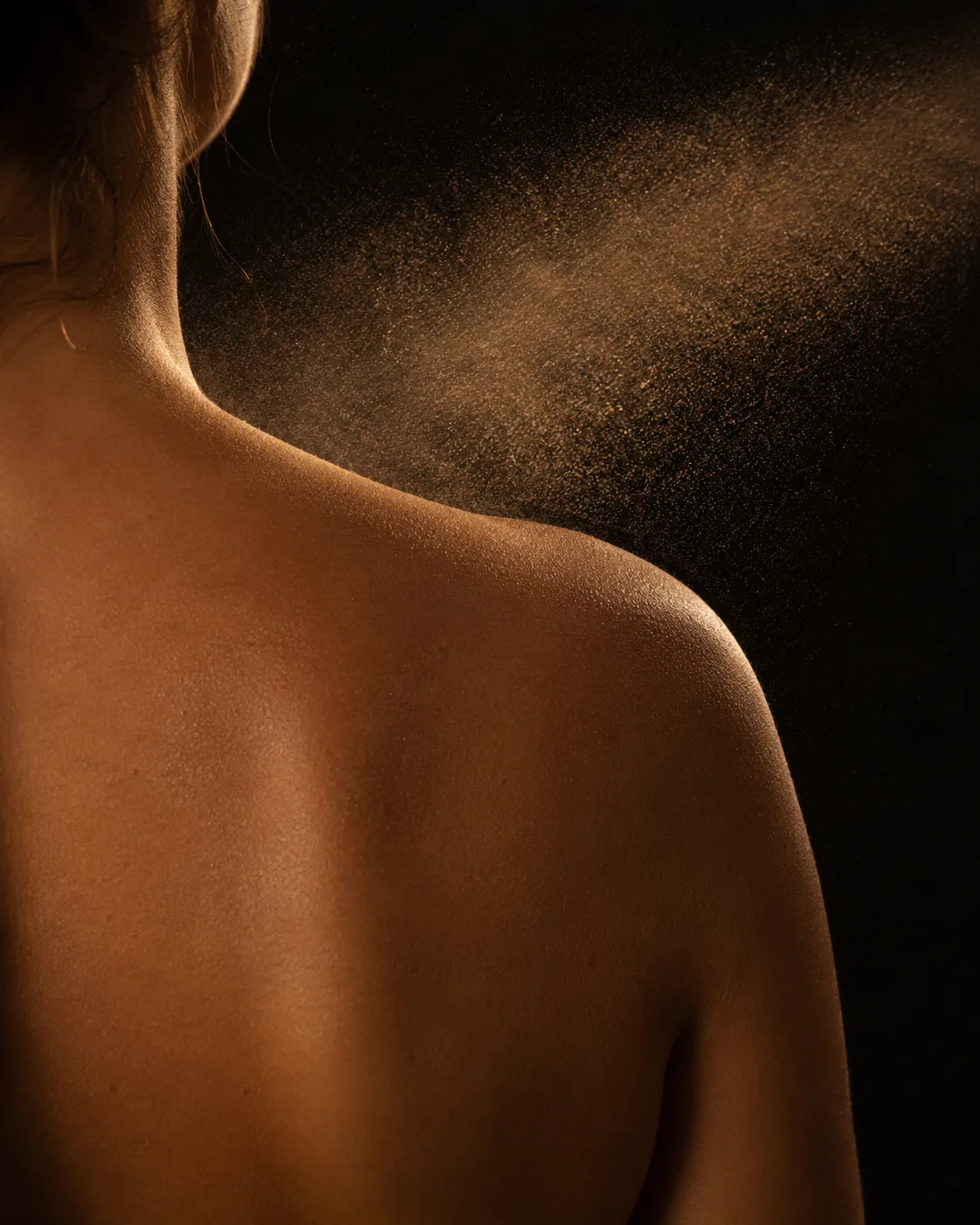 A spray tan being applied